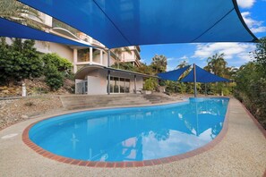Dive into relaxation and enjoy the serene ambiance of the sparkling swimming pool, surrounded by lush greenery—your perfect oasis for unwinding and soaking up the sun.