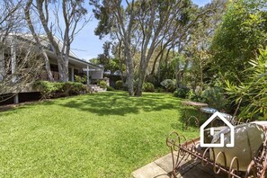 A private garden oasis with floodlit Moonah trees