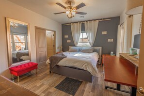 Bedroom one with King bed, ensuite bathroom, Smart TV & ceiling fan.