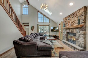 Living room with large couch and fire place