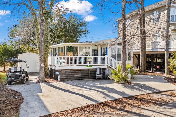 Front of house with golf cart
