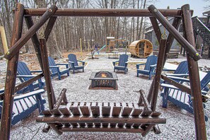 Heart of outdoor relaxation a glowing fire pit to create unforgettable memories.