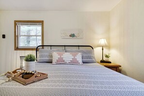 Upstairs King bedroom with closest, bureau and ceiling fan
