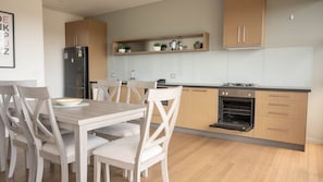 Well equipped kitchen with dining area that seats six.