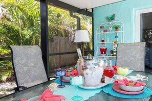 A colorful outdoor bar and dining table make cocktail hour extra fun—mix drinks, enjoy the view, and embrace the tropical lifestyle.