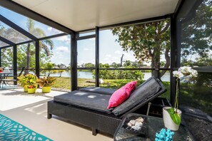 Lounge in style on the oversized daybed, dine under the lanai, or play classic outdoor games like cornhole and the Bimini ring game—fun for all ages.