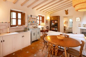 Kitchen and dining table for 4 situated within the living area