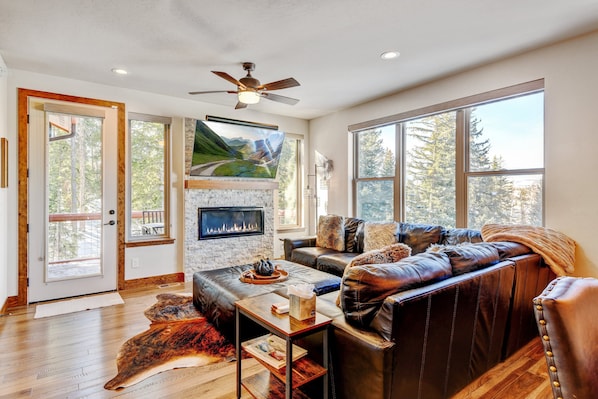 Living Area Features a Relaxing Fireplace and 65" Smart TV Equipped with Cable and Streaming Apps.