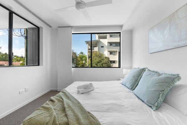 Spacious King bedroom with ceiling fan and central air conditioning keep the room perfectly temperate all year round.