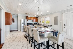 Spacious kitchen with dining table that has seating for 6, extra seats available too!