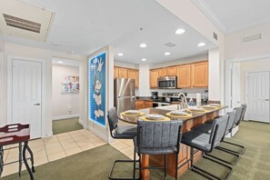 Another angle of the sleek and functional kitchen, highlighting ample counter space.