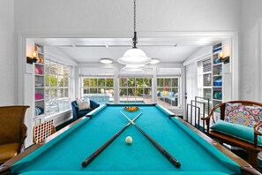 Game room with Billiards Table and Arcade Machine.