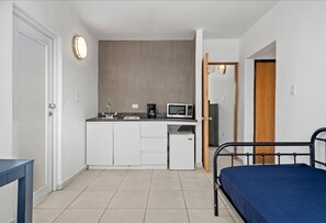 This inviting room offers a perfect mix of modern amenities and natural light, providing a peaceful retreat after a day of exploration.






