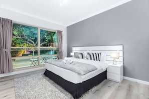 Bedroom Retreat: Elegant style meets natural light, perfect for rest and relaxation.