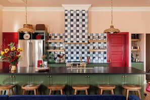 The Show stopping Kitchen- features a 12 foot island and high end appliances. 