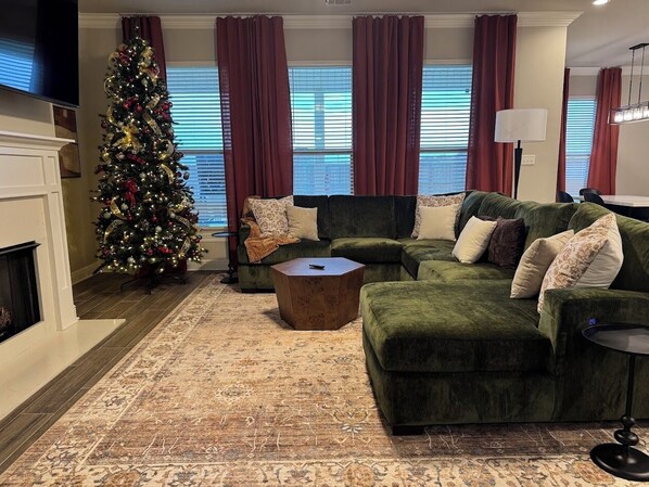 Curl up by the fire and enjoy your favorite show. This living room was made for quiet nights in. Stay tuned for professional photos!