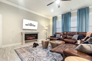 Relax in the modern living room of this pet-friendly and best Airbnb in Lake Charles. Featuring stylish furnishings and a cute dog, it’s the perfect spot to unwind and enjoy your stay.