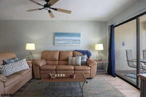 Sunlight streams in from the sliding glass doors that lead to your Screened In Lanai
