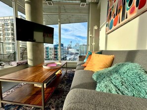 The tiny cozy living room feels spacious with the wide open view.