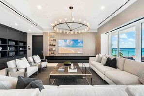 Spacious living area with designer furnishings and oceanfront views.