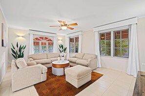 - Relax in this sun-kissed living room, perfect for unwinding with loved ones - Plush sofas, vibrant decor, and warm tones create a vibe that’s both chic and cozy - A space designed for laughter, comfort, and cherished memories for memorable stay
