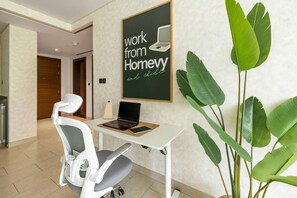 Work desk with comfy chair and nearby power outlets for easy setup