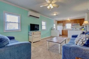 Unwind in the cozy living room of our Soundview retreat. Breathtaking coastal charm and stylish decor create the perfect atmosphere to relax after a day of beach adventures.