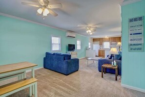 Spacious Living, Dining, and Kitchen areas, all imbued with a charming coastal ambiance.