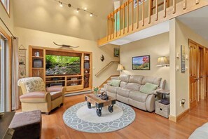 Living Room:Sink into our comfortable sofas, bask in natural light from open windows, and unwind by the indoor wood-burning fireplace.