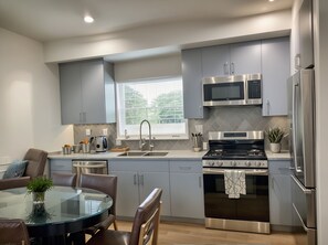 Open Concept: Seamless flow between kitchen and living areas.
