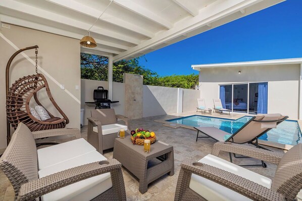 This cozy space is perfect for lounging with a book, sipping a refreshing drink, or simply soaking in the peaceful surroundings.