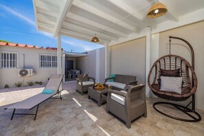 Unwind in style with our comfortable outdoor lounge chairs and shaded seating. Overlooking the sparkling pool, it’s an ideal spot for morning coffee, afternoon relaxation, or evening conversations under the stars.