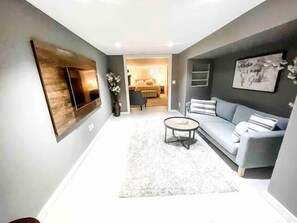 Living room with TV and comfortable seating