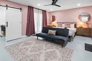 Spacious Primary bedroom on the first floor with en-suite bath and private screened patio, offering comfort and tranquility