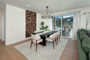 Beautiful dining room with large wood table and seating for up to 6 people.