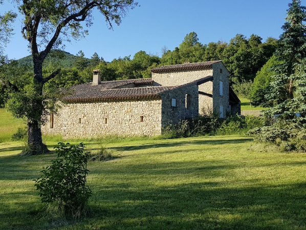 Stone house in a peaceful, green setting