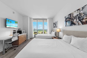 Your waterfront retreat awaits! Our balcony provides front-row seats to boat activity, friendly manatees, and colorful fish, all beneath the sunset's warm glow. Sleep soundly on two full-sized beds.