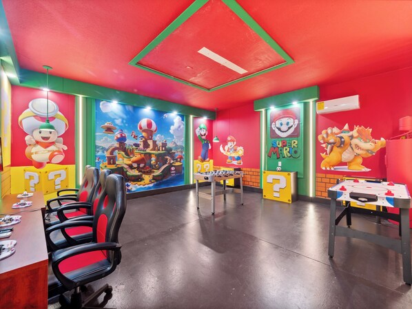 Spectacular Games Room with Small Foosball & Air Hockey Tables, Flat Screen TVs and Game Consoles!
