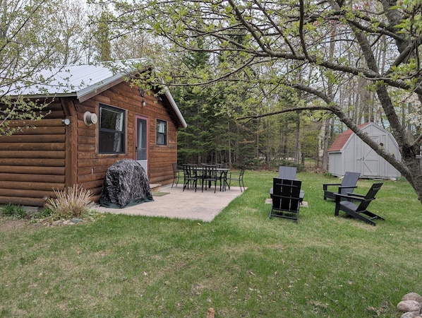 front of cabin showing patio
, grill and outdoor seating