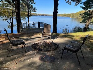 Relax by the fire and enjoy a peacful sunset overlooking Bashaw Lake. 