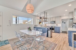 The great room flows seamlessly into the kitchen & dining areas.