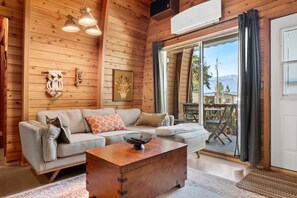 Cozy living room with a Smart TV, sound system, board games & a wood-burning stove. Please note that wood is not provided, but is easily purchased at nearby gas stations.