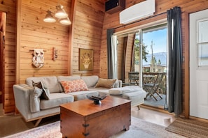Cozy living room with a Smart TV, sound system, board games & a wood-burning stove. Please note that wood is not provided, but is easily purchased at nearby gas stations.