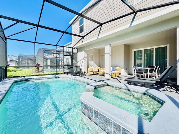Relax in the private pool with an outdoor table, BBQ, and sun loungers.