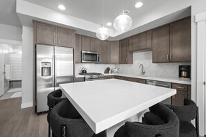 Chef's kitchen with high-end appliances to prepare all of your snacks and meals