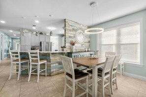 A welcoming dining space with a stylish table, ideal for sharing meals and creating memories.