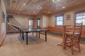 The lower level offers Ping-Pong, Pop-A-Shot Basketball, and a mini golf.