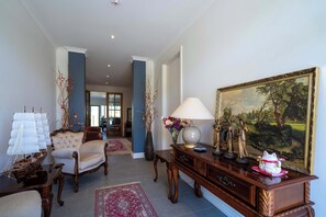 Welcoming entrance filled with antique-style furniture