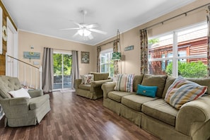 Seating for the whole family and a sliding glass door for access to the screened in back patio.