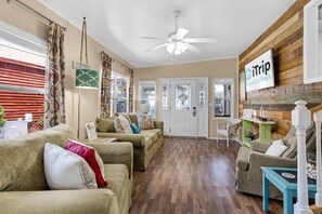 The natural light filled living room is open and spacious.